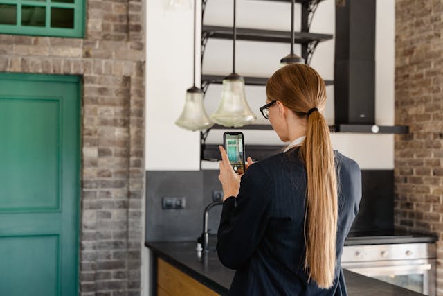 person taking a photo of a property interior
